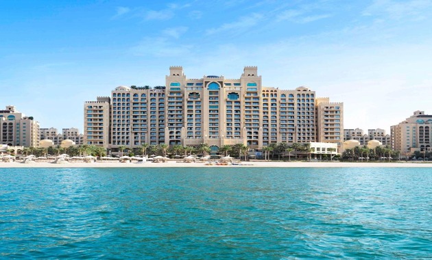 a large building with persony windows on the beach