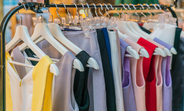 different pile of clothes hanging on a hanging stand