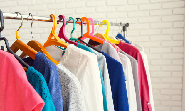 different color clothes hanging on a hanging stand