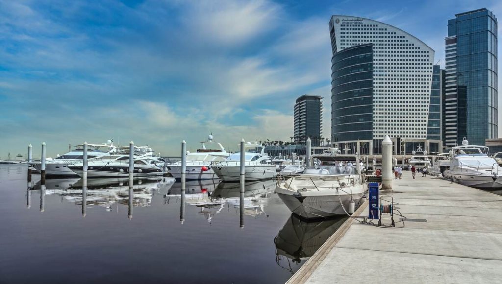 a group of boats in a harbor at dubai