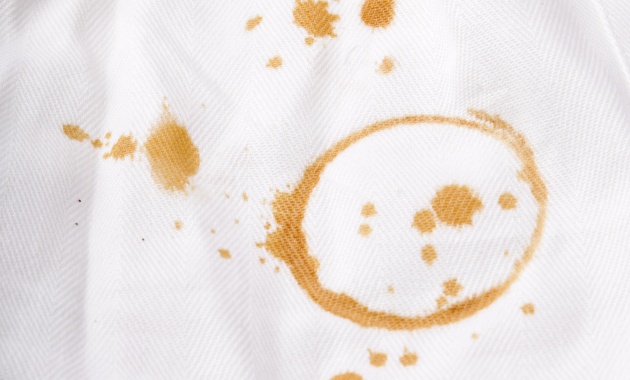 a white piece of clothes with oil stains