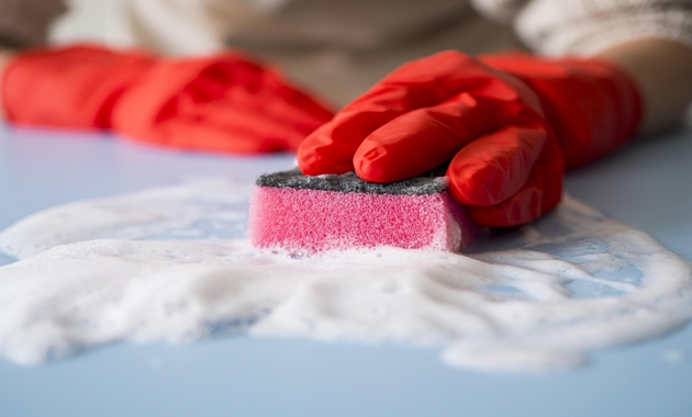 a man is cleaning household with borax and vinegar