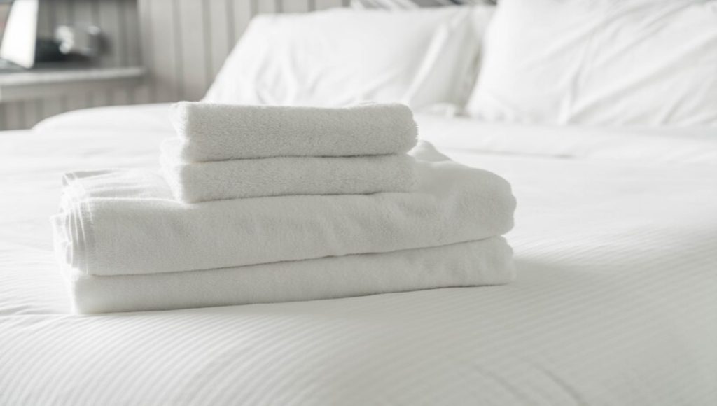 pile of white bed linens