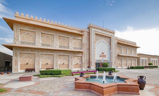 a building with a fountain in front of it