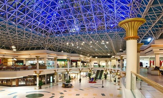 a large shopping mall with a glass roof