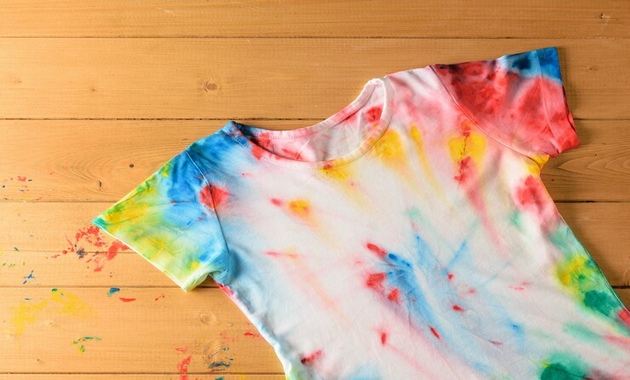 a white shirt with colour transfer stains on it 