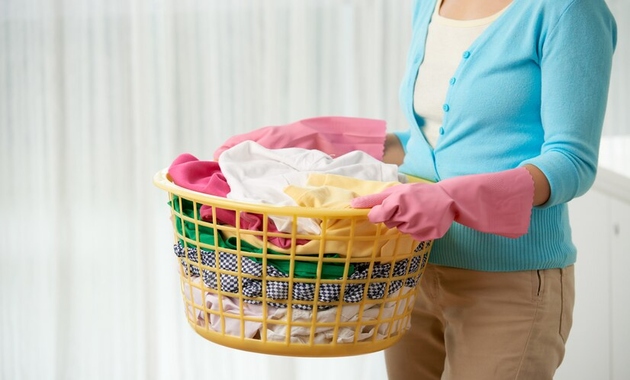 a bucket full of dirty clothes 