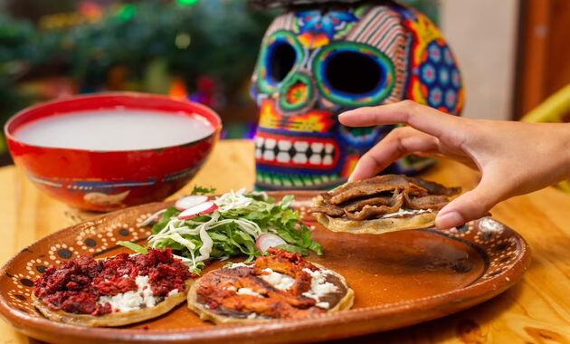 a table with famouse mexican food on a plate