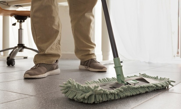 a man is mopping the floor